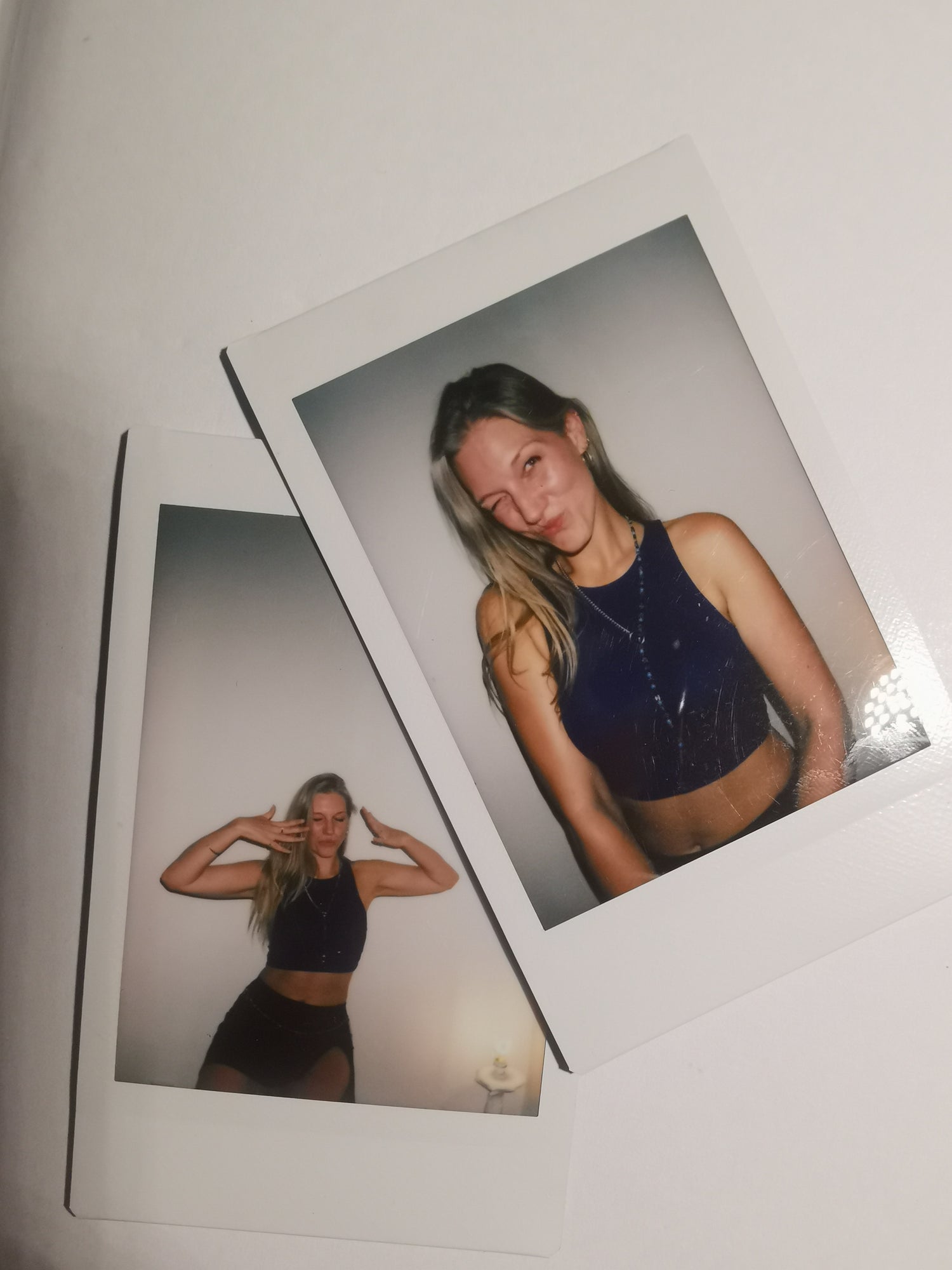 Joyfull and happy photo of SOIRA founders and female business owner Sarah Hanisch wearing SOIRA jewlry. SOIRA necklace, rings, bracelets and belt. Handmade in berlin. polaroid