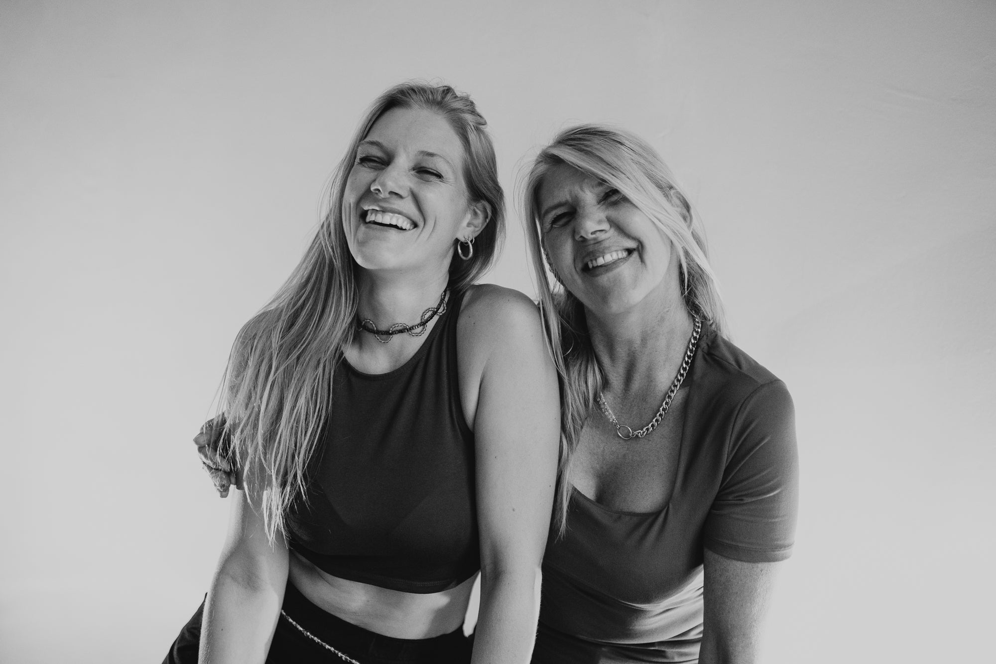 Joyfull and happy photo of SOIRA founders and female business owner Sarah Hanisch and Yvonne Hartung wearing SOIRA jewlry. SOIRA necklace, rings, bracelets and belt. handmade in berlin
